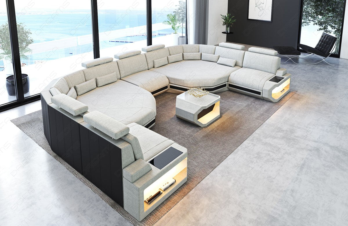 XXL Polster Wohnlandschaft Asti in elfenbein - Hugo1 mit der Nebenfarbe Schwarz. Couchtisch und USB Anschlüsse sind optional erhältlich.