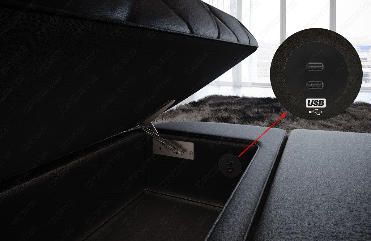 Detailbild der aufklappbaren Armlehne mit optionalem USB-Anschluss beim Sofa Positano