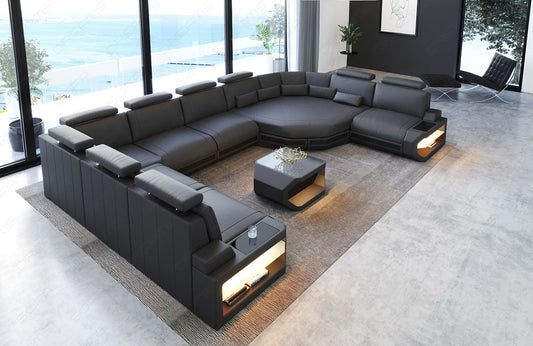 Moderne Leder Wohnlandschaft Asti U Form in grau-schwarz. Couchtisch und USB Anschlüsse sind optional erhältlich.